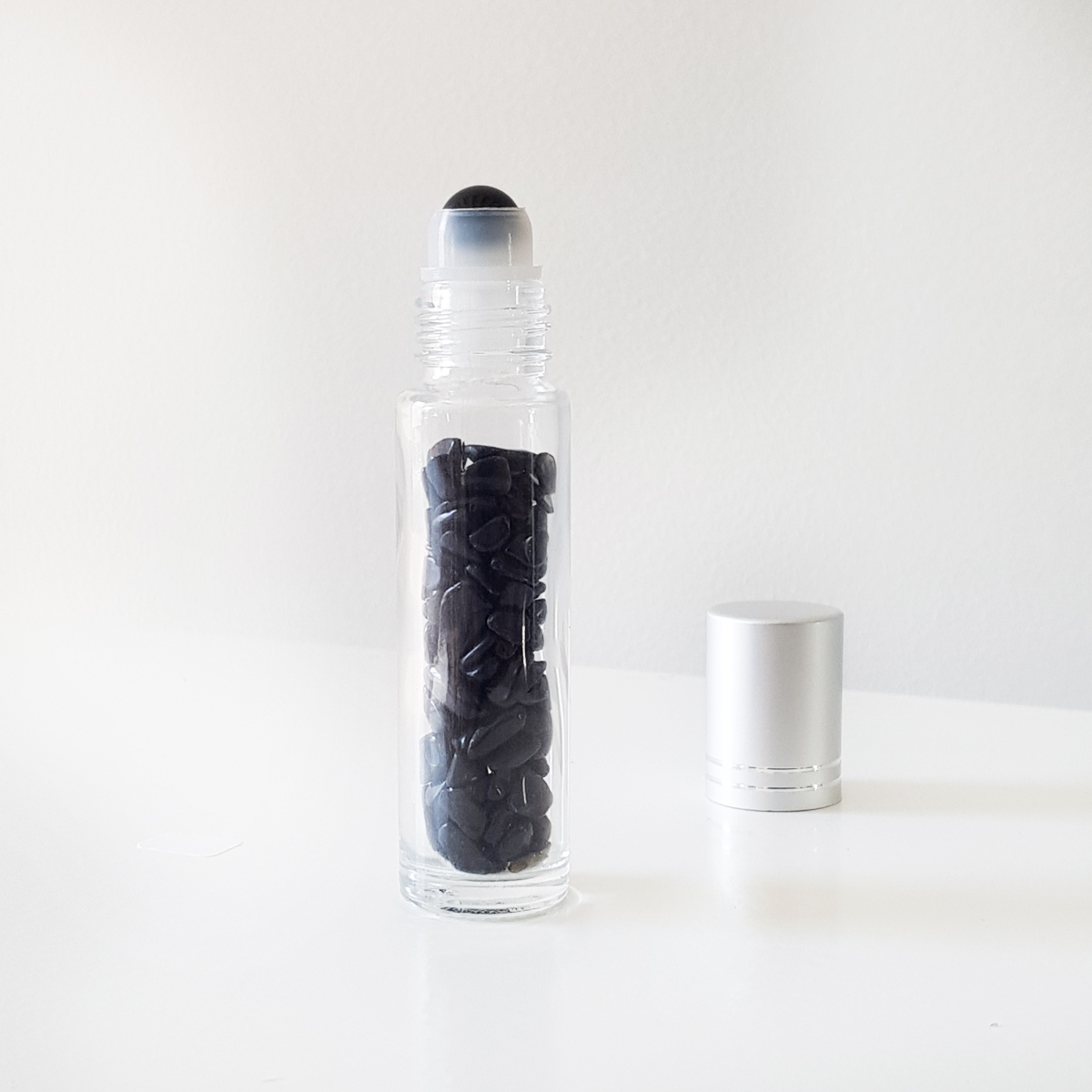 botellita roll-on de obsidiana negra